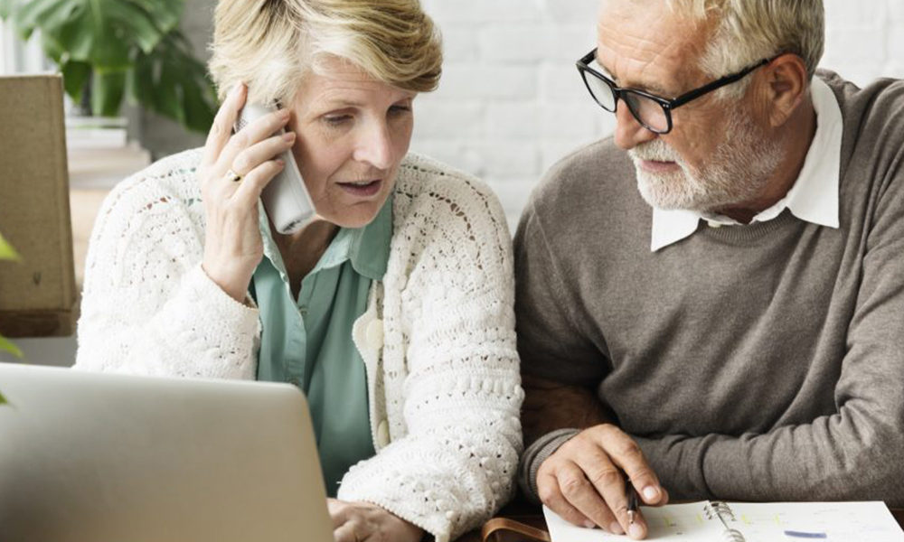 Senior talking on phone to get help with services